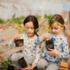 Kids planting seedlings – Family Farm Experience