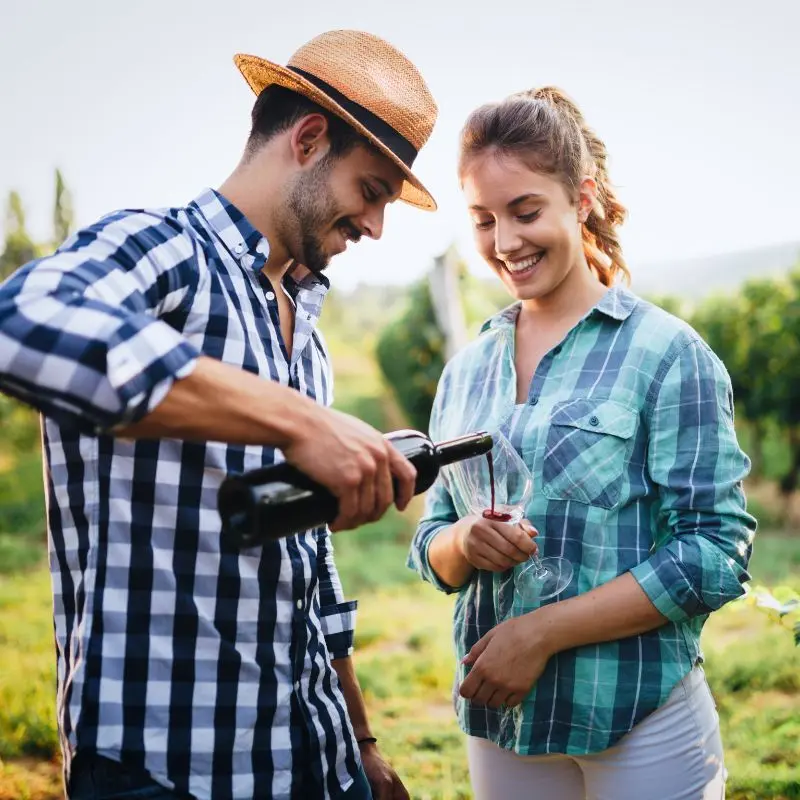 Shared moments in the vineyards—wine, sunshine, and unforgettable company.