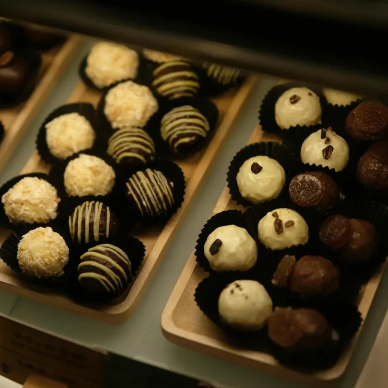 Display of assorted handmade chocolates in a Mendoza chocolate shop